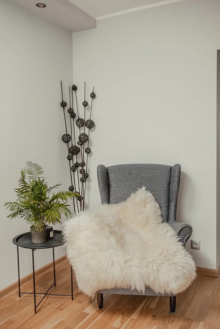 Two stitched sheepskins, white