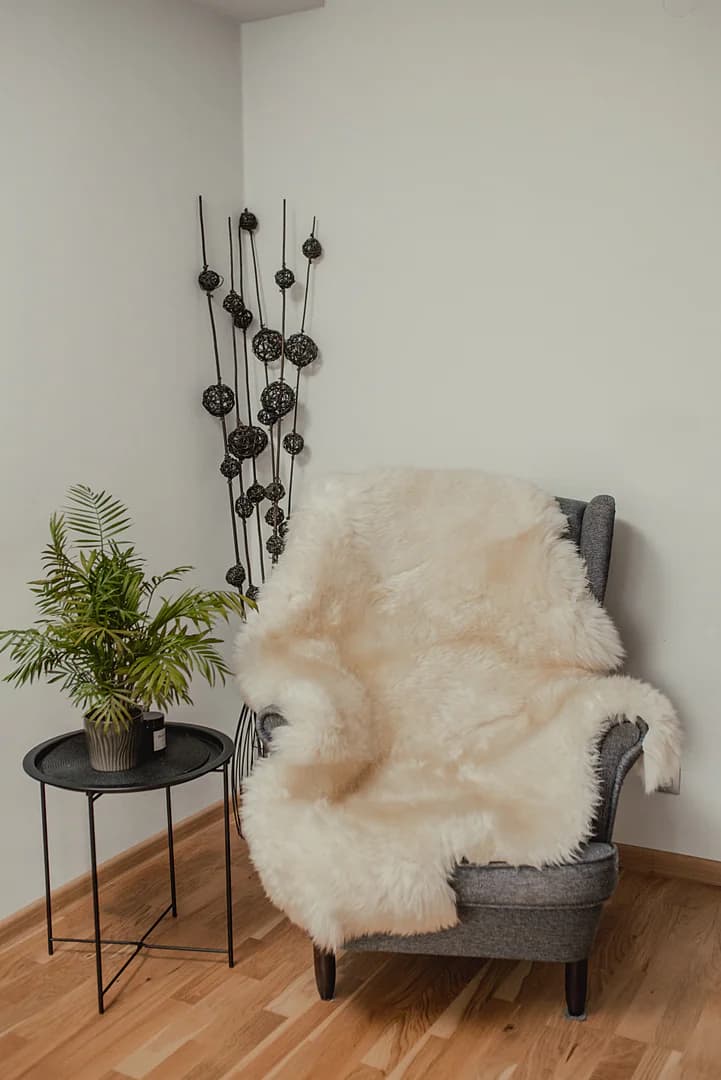 Three stitched sheepskins, white