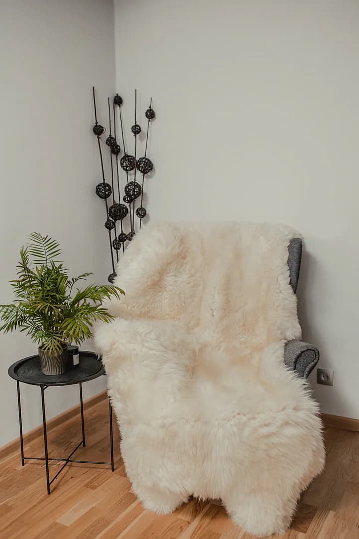 Four stitched sheepskins, white